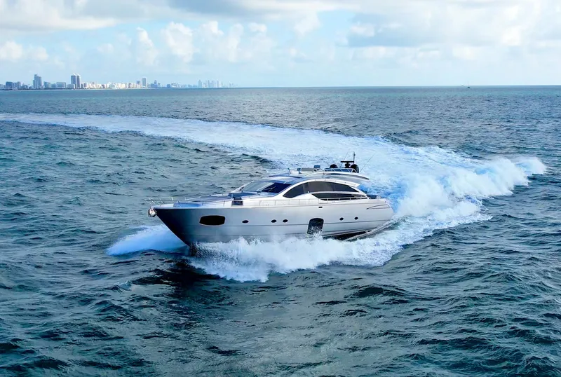 Slide: The Image of Luxury 2013 Pershing 82 yacht cruising on open sea under clear skies. - 26