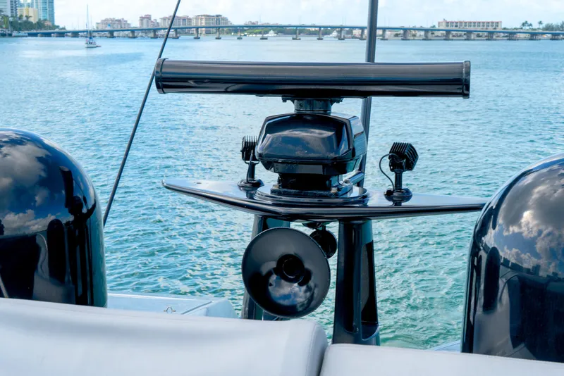 Slide: The Image of Radar equipment on a 2013 Pershing 82 yacht with scenic water backdrop. - 29