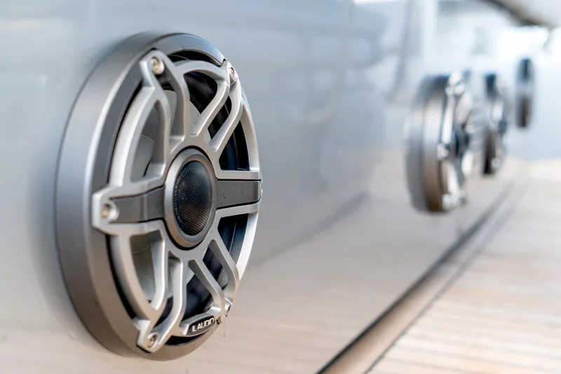 Slide: The Image of Close-up of marine speakers on a 2013 Pershing 82 yacht exterior. - 32