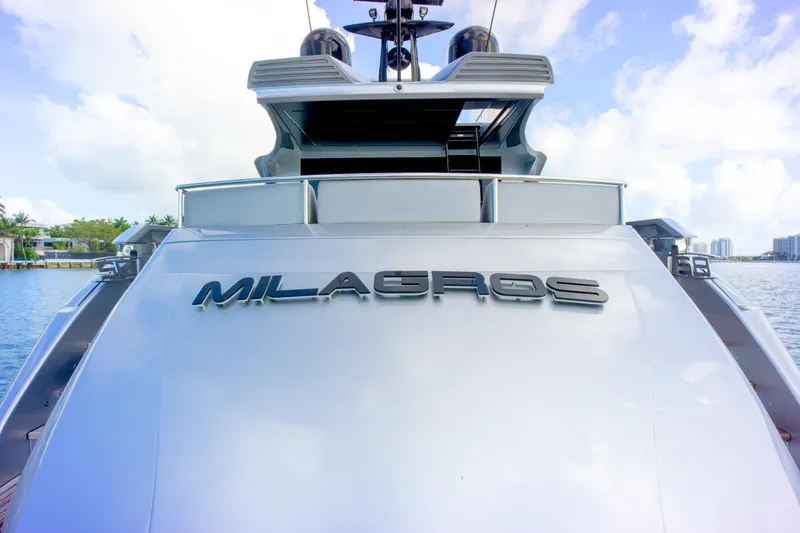 Slide: The Image of 2013 Pershing 82 yacht "Milagros" on water, showcasing sleek design and luxury features. - 35