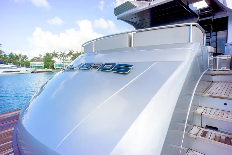 Slide: The Image of Luxury Pershing 82 yacht docked, showcasing sleek design and modern features, 2013 model. - 36