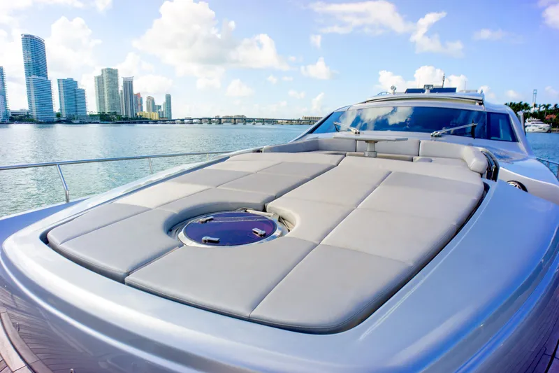 Slide: The Image of Luxury 2013 Pershing 82 yacht with sun deck, city skyline in background. - 40