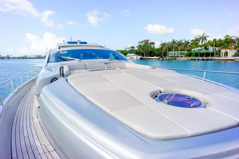 Slide: The Image of Luxury 2013 Pershing 82 yacht on serene water with palm trees in background. - 41