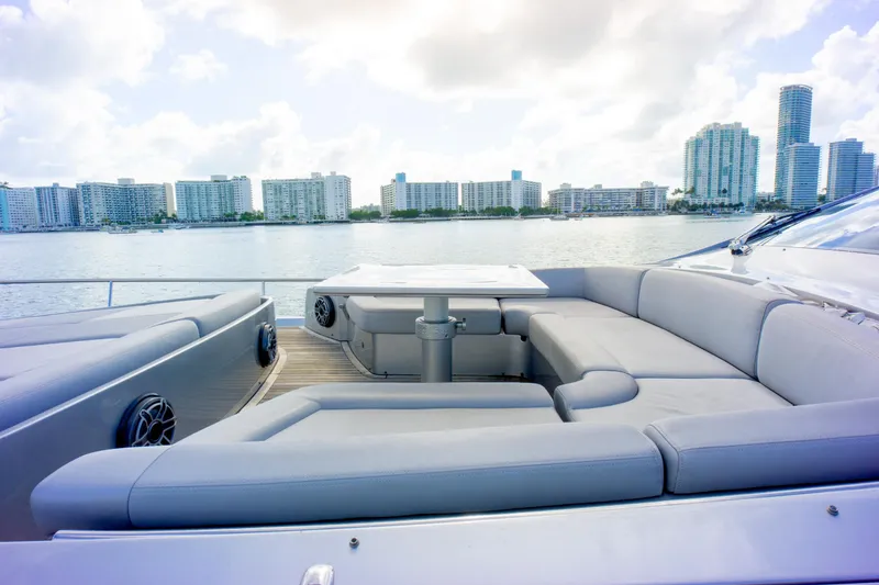 Slide: The Image of Luxurious 2013 Pershing 82 yacht with spacious deck seating and city skyline view. - 45
