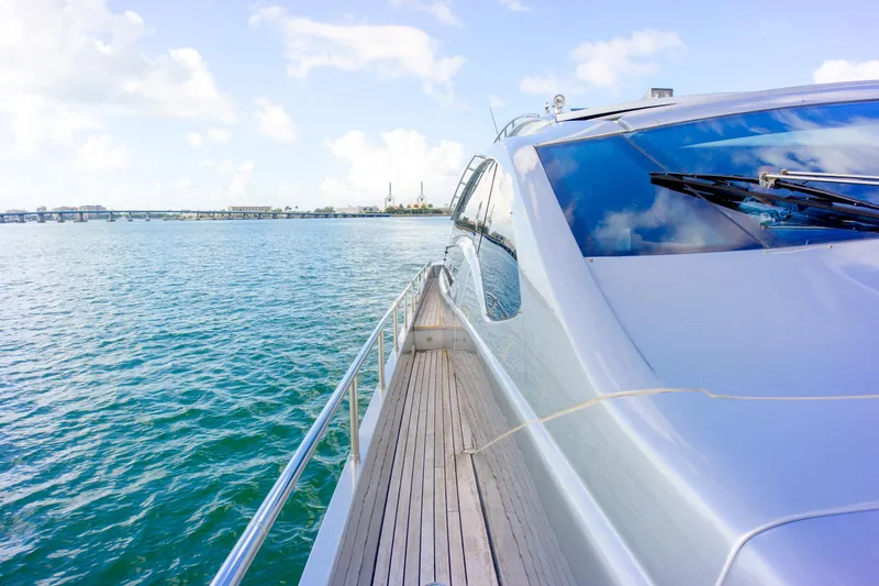 Slide: The Image of Luxurious 2013 Pershing 82 yacht cruising on serene blue waters under a clear sky. - 47