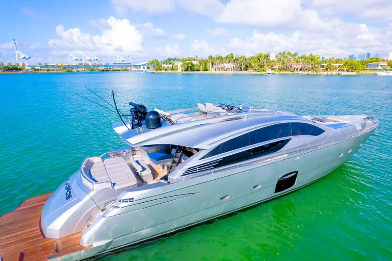 Slide: The Image of Luxurious 2013 Pershing 82 yacht cruising on turquoise waters under a clear sky. - 9