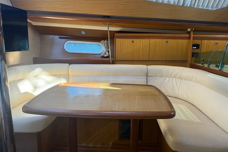 Slide: The Image of 2008 Jeanneau Sun Odyssey 42 DS sailboat docked on a calm lake. - 21