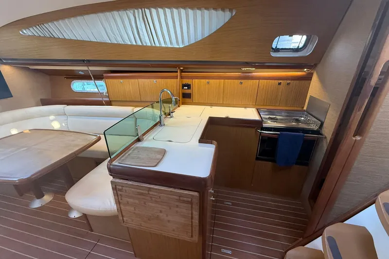 Slide: The Image of Interior of 2008 Jeanneau Sun Odyssey 42 DS sailboat, featuring wood finishes and modern amenities. - 22