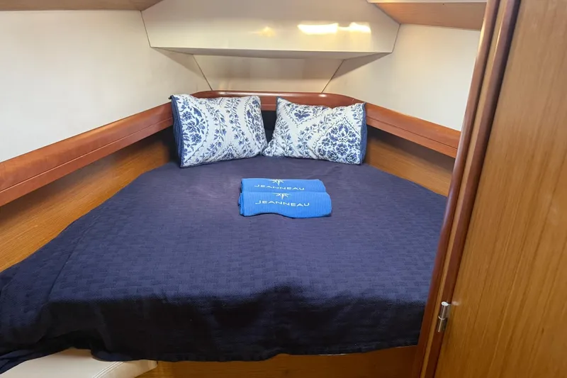 Slide: The Image of Cozy cabin interior of 2008 Jeanneau Sun Odyssey 42 DS with bed and pillows. - 30