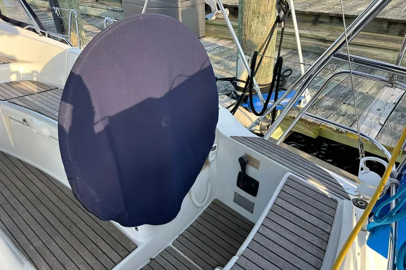 Slide: The Image of Cockpit of 2008 Jeanneau Sun Odyssey 42 DS sailboat with covered steering wheel. - 9
