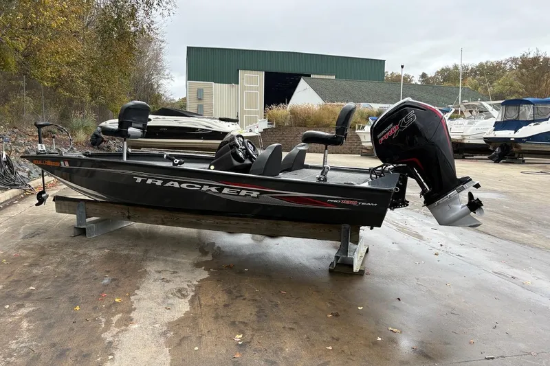 The Image of 2021 Tracker Pro Team 190 TX boat on a stand, outdoor setting. - 1