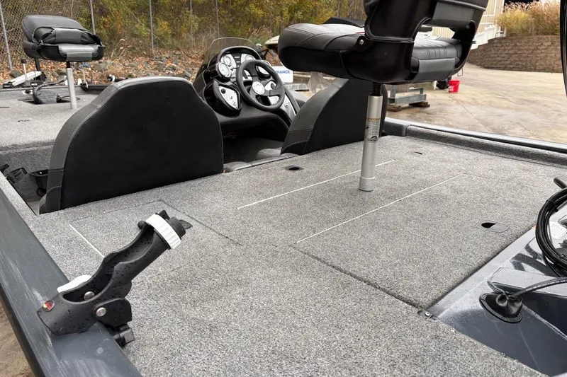 Slide: The Image of 2021 Tracker Pro Team 190 TX boat interior with seating and steering console. - 10