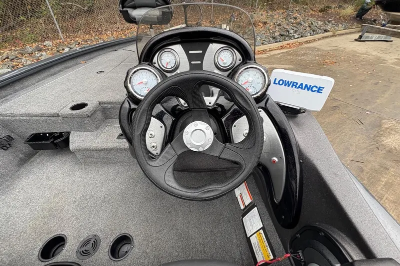Slide: The Image of 2021 Tracker Pro Team 190 TX boat dashboard with steering wheel and Lowrance display. - 6