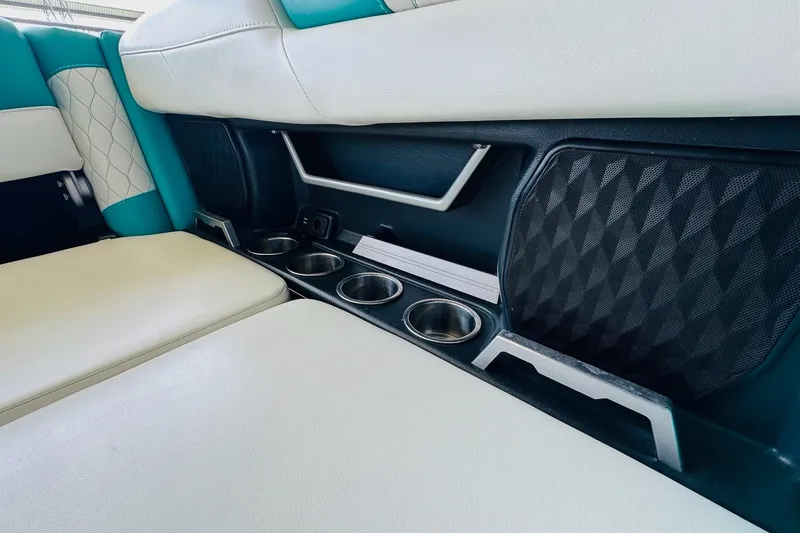 Slide: The Image of Interior of 2021 Malibu M240 boat with cup holders and stylish seating. - 32