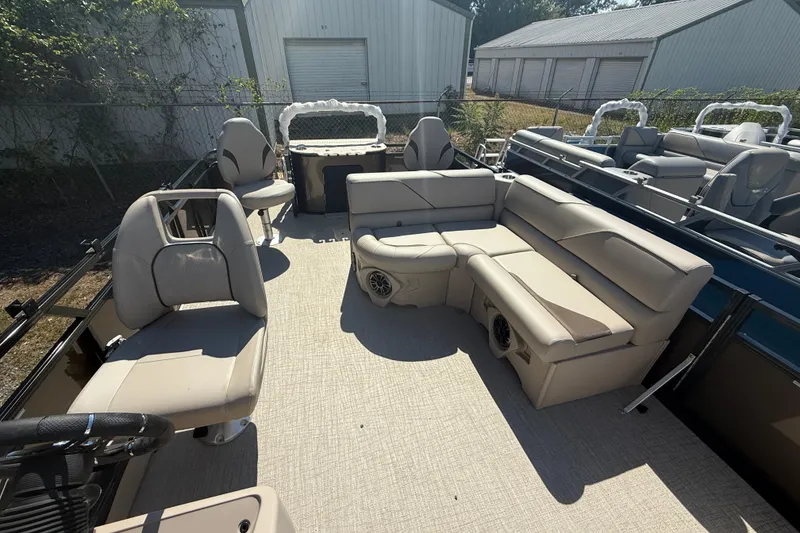 Slide: The Image of 2026 Tahoe Pontoon Sport 85 Rear Fish interior with beige seating and fishing setup. - 7