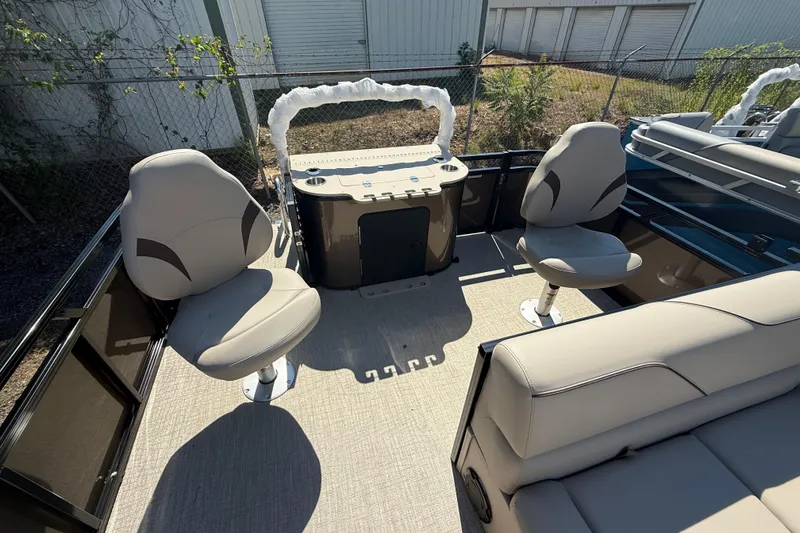 Slide: The Image of 2026 Tahoe Pontoon Sport 85 Rear Fish interior with swivel seats and fishing station. - 9