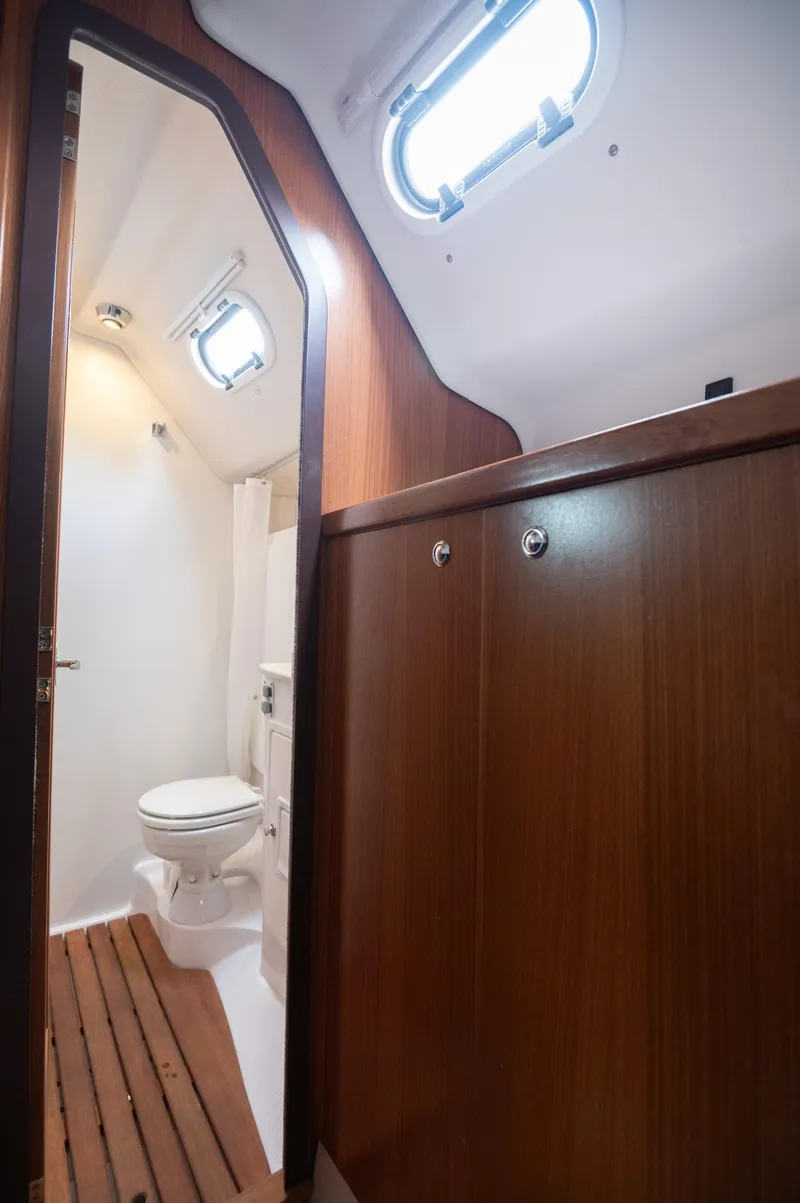 Slide: The Image of 2024 Catalina 445 yacht bathroom with wooden cabinetry and modern fixtures. - 17