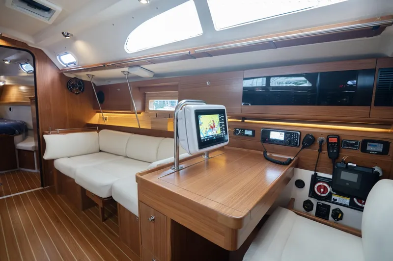 Slide: The Image of 2024 Catalina 445 yacht interior with modern navigation equipment and comfortable seating. - 2