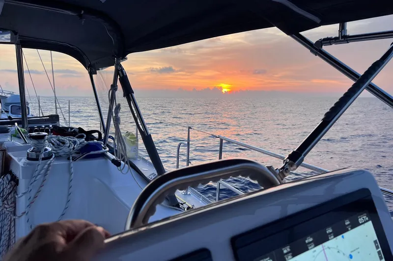 Slide: The Image of 2024 Catalina 445 sailboat at sea during a vibrant sunset. - 33