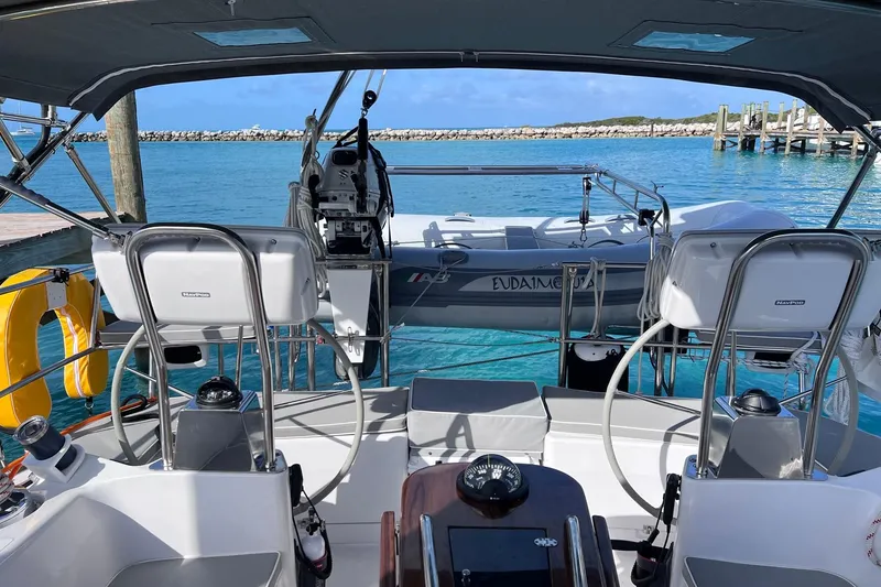 Slide: The Image of 2024 Catalina 445 sailboat cockpit with dual steering wheels and ocean view. - 35
