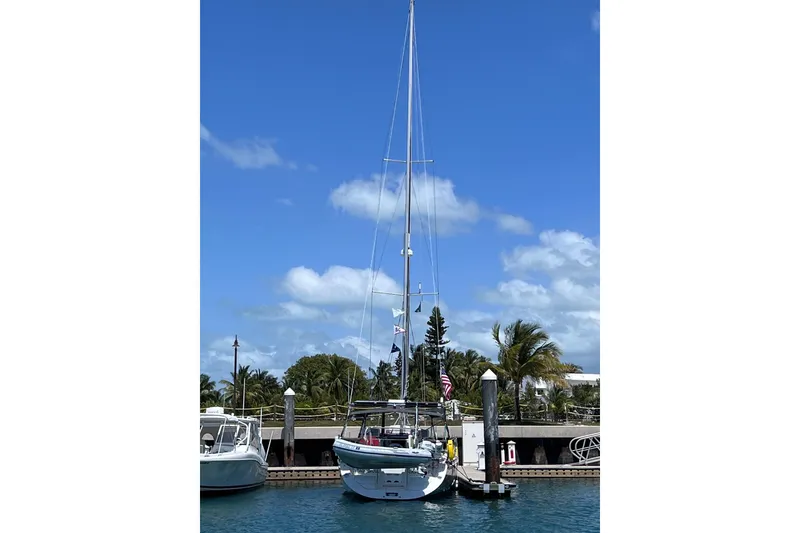 Slide: The Image of 2024 Catalina 445 sailboat docked in a sunny marina with palm trees. - 36