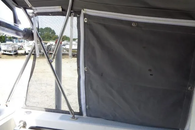 Slide: The Image of 2004 C-Dory 22 Cruiser interior view with canvas cover and window. - 24