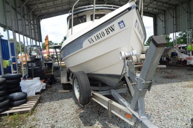 Slide: The Image of 2004 C-Dory 22 Cruiser on trailer in covered storage area. - 34