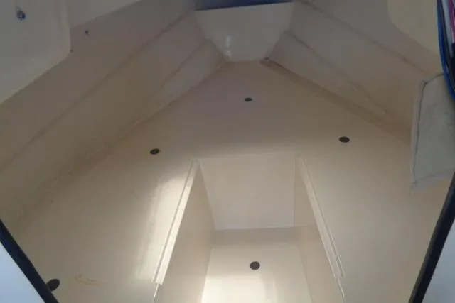 Slide: The Image of 2004 C-Dory 22 Cruiser interior cabin view, showcasing spacious layout and clean design. - 37