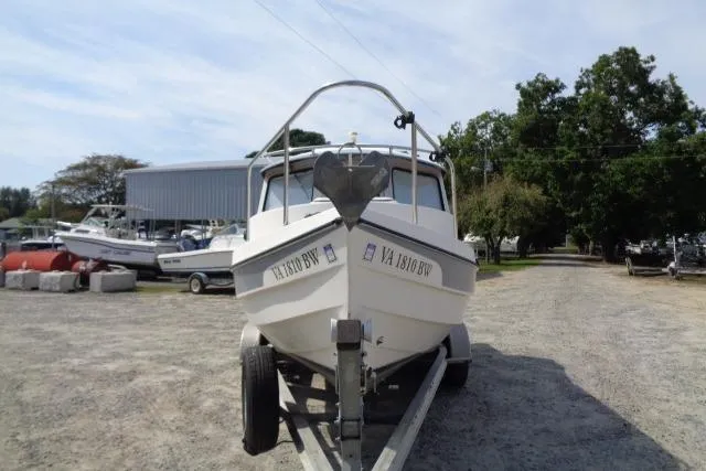 Slide: The Image of 2004 C-Dory 22 Cruiser on trailer in outdoor storage area. - 5