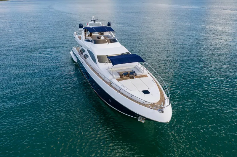Slide: The Image of Azimut 98 Leonardo 2006 yacht cruising on calm blue waters. - 12