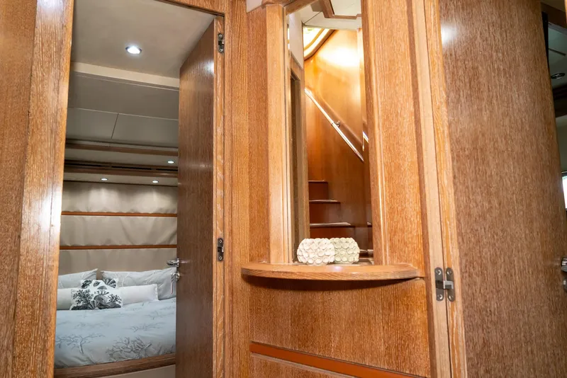 Slide: The Image of Luxurious interior of 2006 Azimut 98 Leonardo yacht with wooden finishes and cozy bedroom. - 22