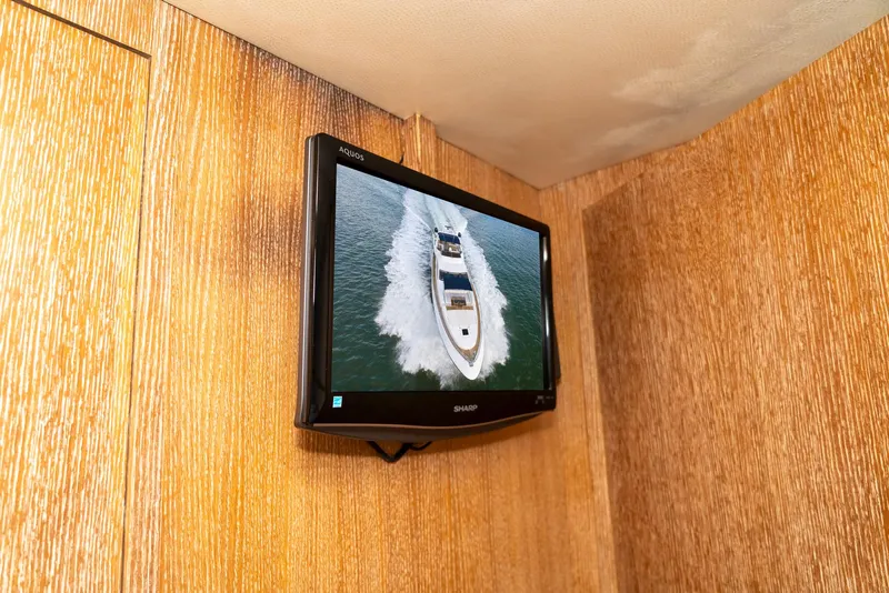 Slide: The Image of Wall-mounted TV displaying Azimut 98 Leonardo yacht cruising on water, 2006 model. - 23