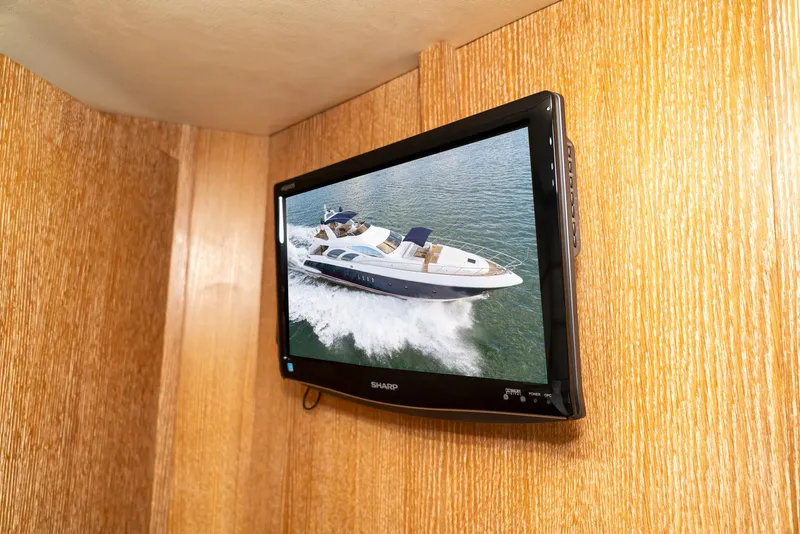 Slide: The Image of Wall-mounted TV displaying Azimut 98 Leonardo yacht cruising on water, 2006 model. - 24