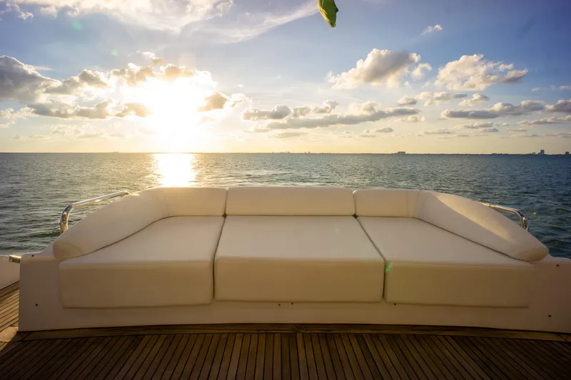 Slide: The Image of Luxurious Azimut 98 Leonardo yacht deck with white sofa, ocean view, and sunset sky, 2006 model. - 27