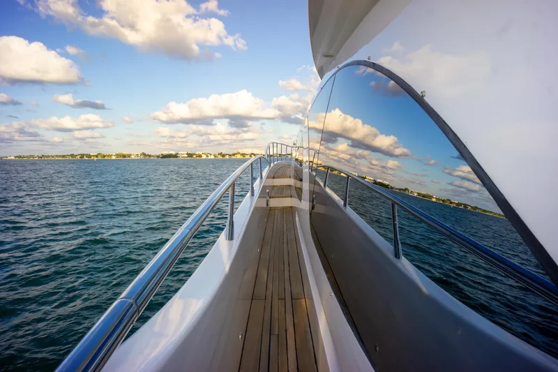 Slide: The Image of Side view of 2006 Azimut 98 Leonardo yacht on open water under a blue sky. - 32