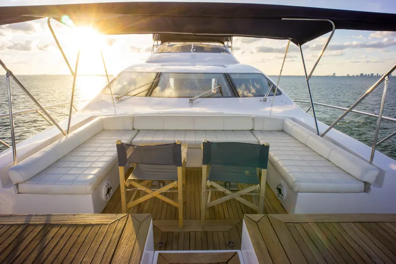 Slide: The Image of Luxurious 2006 Azimut 98 Leonardo yacht deck with seating, ocean view, and sunset. - 37