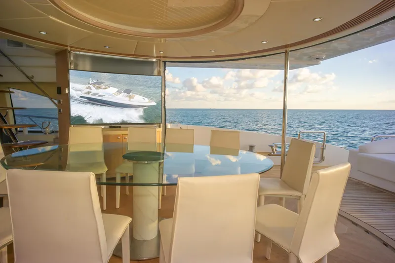 Slide: The Image of Luxurious interior of 2006 Azimut 98 Leonardo yacht with ocean view and elegant dining area. - 44
