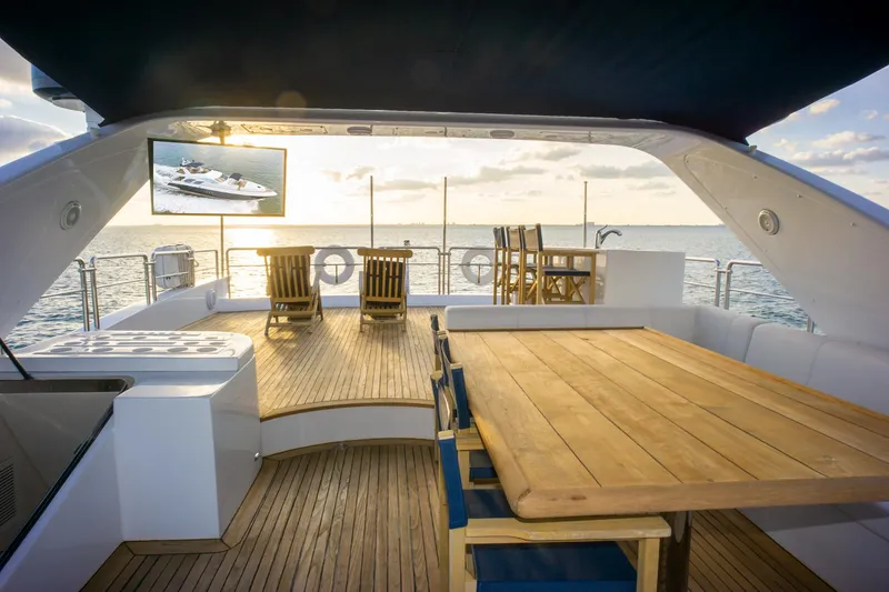 Slide: The Image of Luxurious 2006 Azimut 98 Leonardo yacht deck with wooden furniture and ocean view. - 45