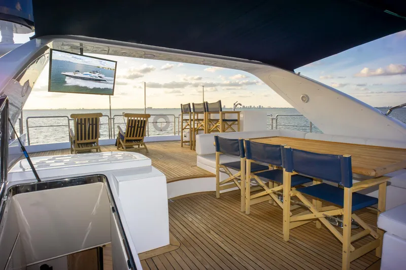 Slide: The Image of Luxurious 2006 Azimut 98 Leonardo yacht deck with seating, ocean view, and TV. - 46