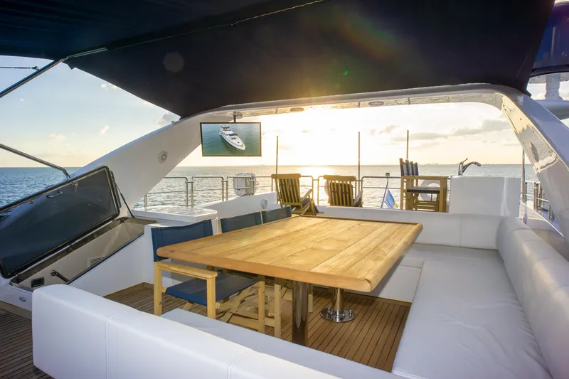 Slide: The Image of Luxurious 2006 Azimut 98 Leonardo yacht deck with sunset view and elegant seating area. - 47