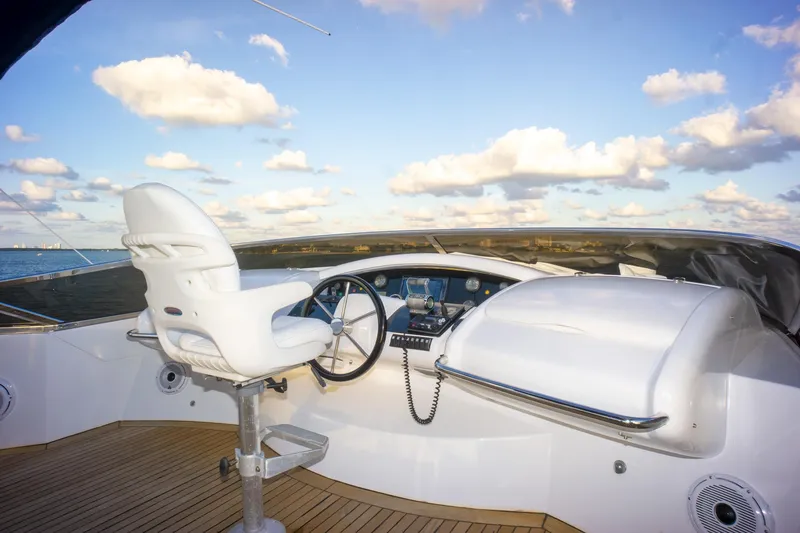 Slide: The Image of Helm of 2006 Azimut 98 Leonardo yacht with steering wheel and captain's chair. - 48