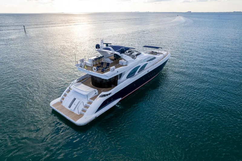 Slide: The Image of Luxury 2006 Azimut 98 Leonardo yacht cruising on open sea at sunset. - 6