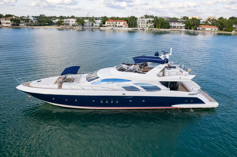 Slide: The Image of Luxury 2006 Azimut 98 Leonardo yacht cruising on serene waters. - 8