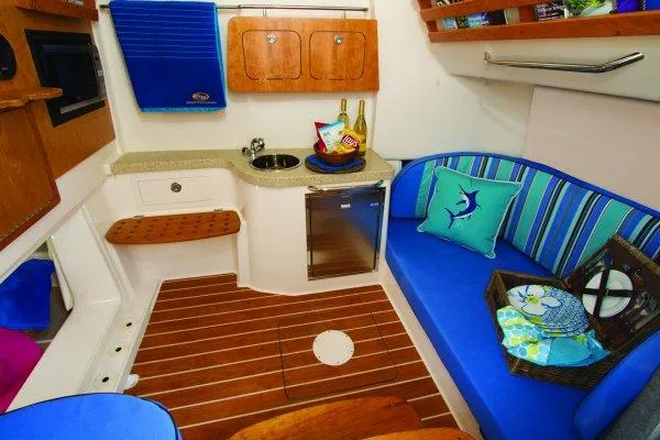 Slide: The Image of Manufacturer Provided Image: 2015 Grady-White Canyon 376 cabin interior with kitchenette and seating area. - 10