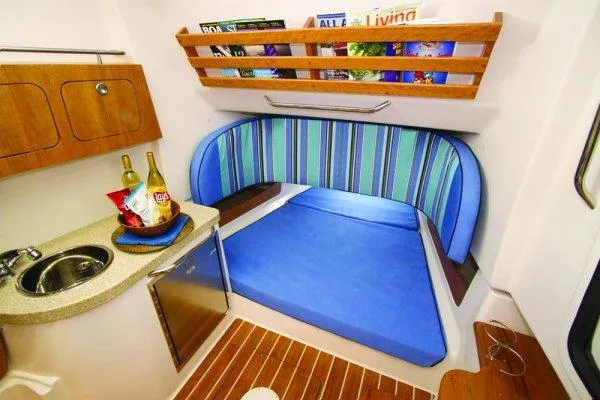 Slide: The Image of Manufacturer Provided Image: 2015 Grady-White Canyon 376 cabin with kitchenette and cozy seating area. - 11