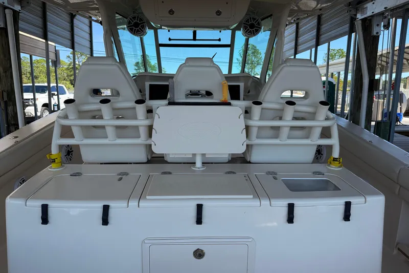 Slide: The Image of 2015 Grady-White Canyon 376 boat interior with seating and storage compartments. - 6