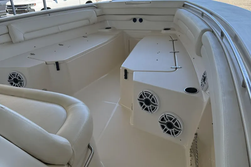 Slide: The Image of 2015 Grady-White Canyon 376 boat interior with seating and speakers. - 9