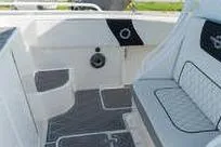 Slide: The Image of 2007 Fountain 38 Tournament Edition boat interior with seating and speaker. - 15