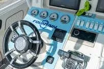 Slide: The Image of Control panel of 2007 Fountain 38 Tournament Edition boat with steering wheel and gauges. - 19