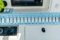Slide: The Image of Control panel of a 2007 Fountain 38 Tournament Edition boat with switches and gauges. - 20
